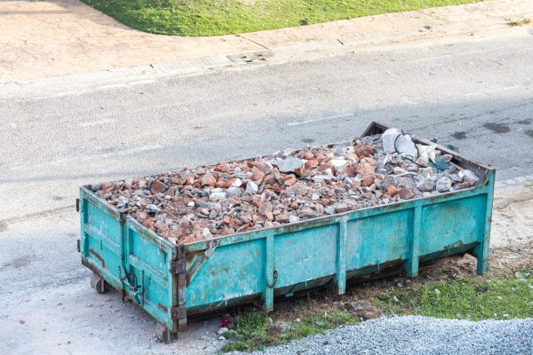 Garbage roro dumpter bin collects rubbish materials at construction site